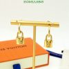 Gold padlock earrings on display with branded box.