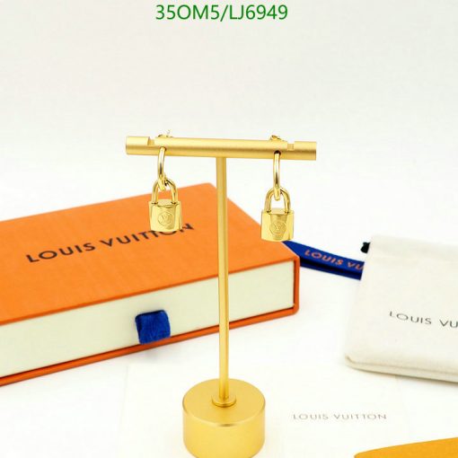 Gold padlock earrings display with branded packaging.