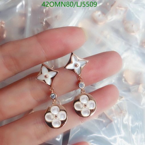 Star and flower dangle earrings with gems.