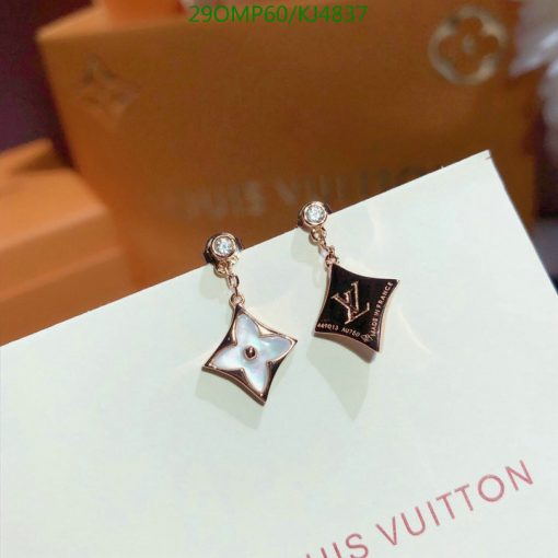 Designer star and logo pendant earrings.