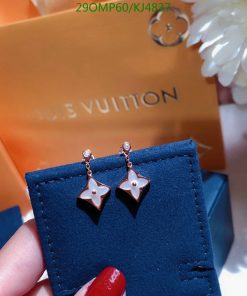 Star-shaped earrings with Louis Vuitton packaging.