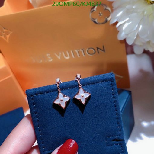 Star-shaped earrings with Louis Vuitton packaging.