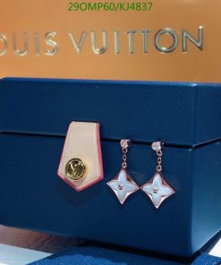 Designer earrings on Louis Vuitton box.