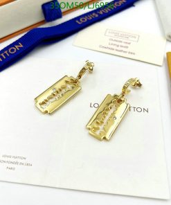 Gold Louis Vuitton razor blade earrings.