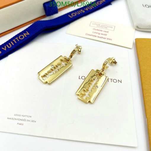 Gold Louis Vuitton razor blade earrings.