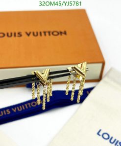 Louis Vuitton branded hair clips on packaging.