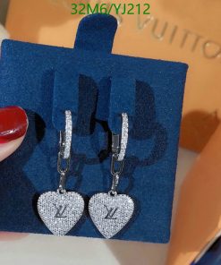 Designer heart-shaped logo earrings on display.