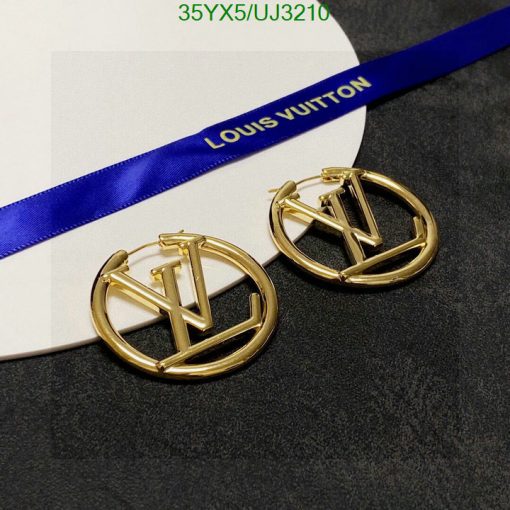 Gold designer logo earrings on card with ribbon.