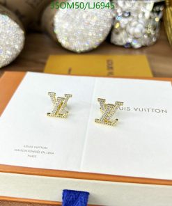 Designer rhinestone earrings on branded display card.