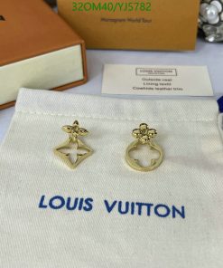 Louis Vuitton gold earrings on branded pouch.