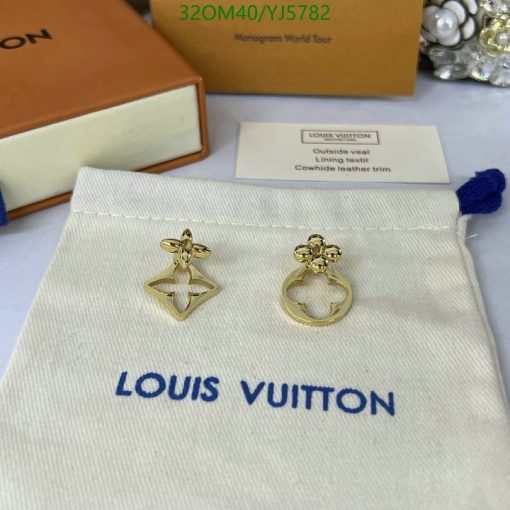 Louis Vuitton gold earrings on branded pouch.