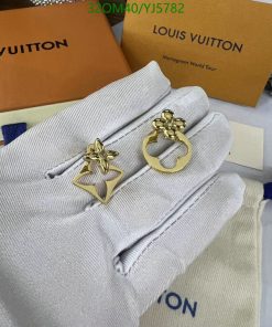 Designer gold earrings on Louis Vuitton packaging.