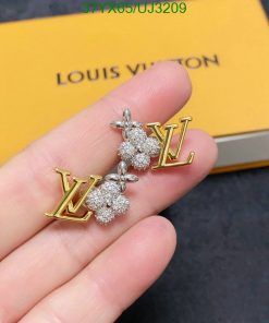 Louis Vuitton logo earrings with diamonds on hand.