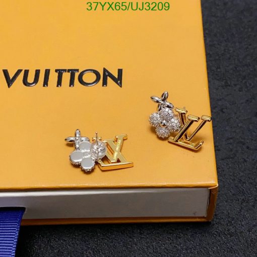 Designer earrings on branded packaging.