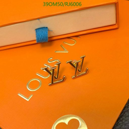 Orange luxury brand packaging with gold lettering.