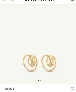 Gold Louis Vuitton logo earrings.