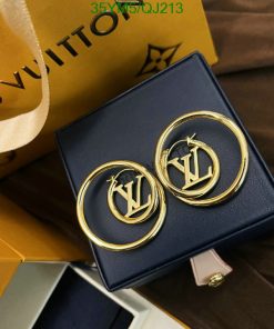 Designer logo earrings on blue box with packaging.