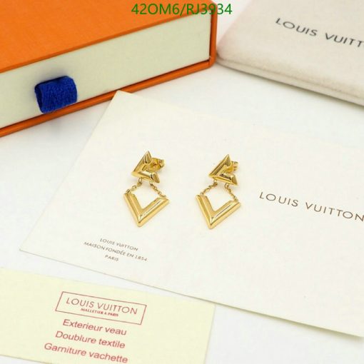 Gold triangle logo earrings on designer packaging.