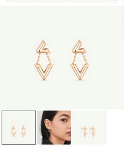 Louis Vuitton gold earrings ad with model.