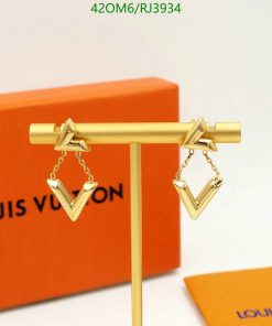 Gold Louis Vuitton earrings on display stand.