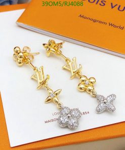 Designer logo drop earrings with floral and star motifs.