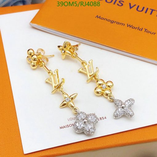 Designer logo drop earrings with floral and star motifs.