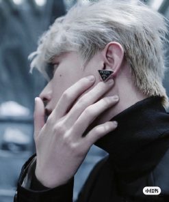 Person showcasing Prada earring.