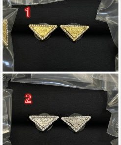 Gold and silver triangle fashion earrings on black background.