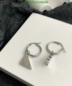 Silver triangular pendant hoop earrings on white box.