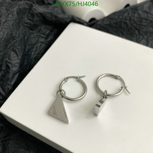 Silver triangular pendant hoop earrings on white box.