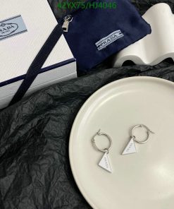 Prada earrings on plate with gift box and pouch.