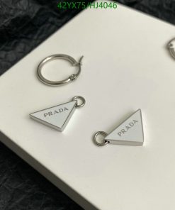 Prada silver triangle earrings on white background.