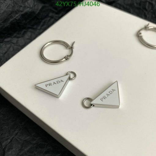 Prada silver triangle earrings on white background.