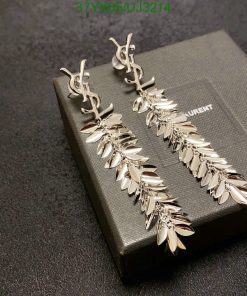 Silver leaf design earrings on black background.