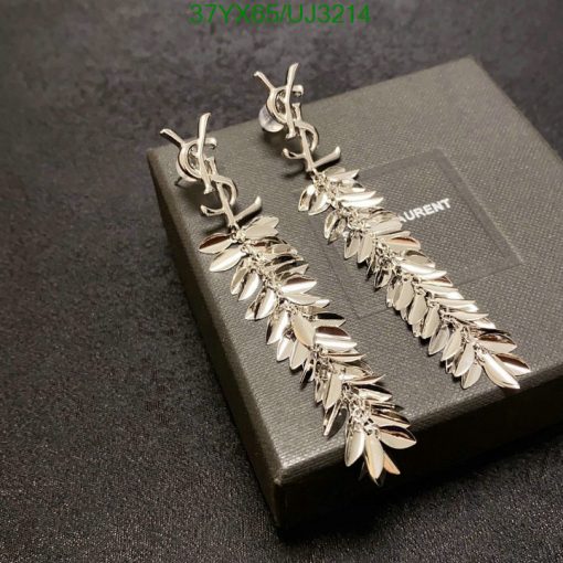 Silver leaf design earrings on black background.