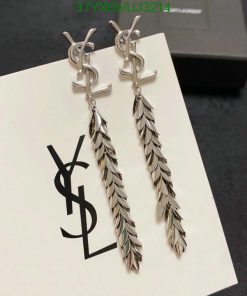 Designer leaf-style drop earrings on branded card