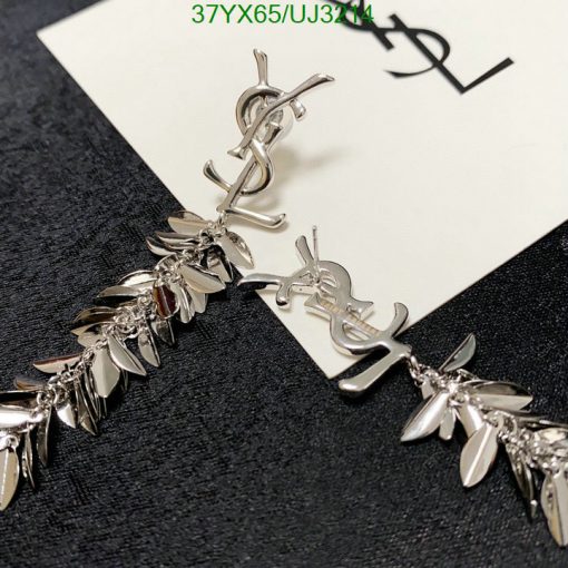 Designer silver leaf motif earrings on card.