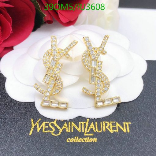 Gold logo earrings with rhinestones on white petals.