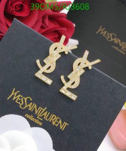 Gold dollar-sign earrings on branded black box.