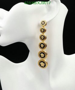 Long gold coin dangle earrings on mannequin