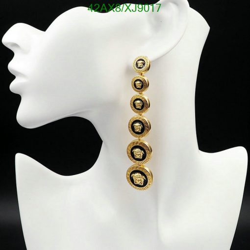 Long gold coin dangle earrings on mannequin