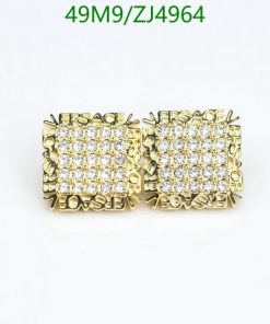 Gold diamond stud earrings on white background.