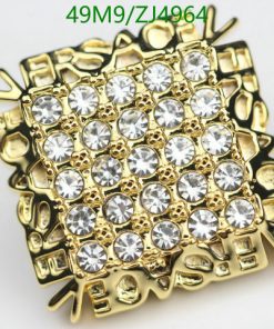 Gold rhinestone studded ring jewelry close-up.