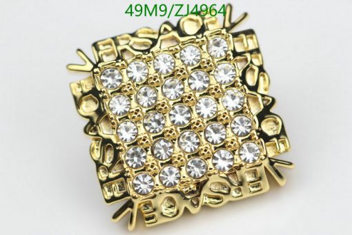 Gold rhinestone studded ring jewelry close-up.