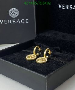 Versace gold hoop earrings in branded box.