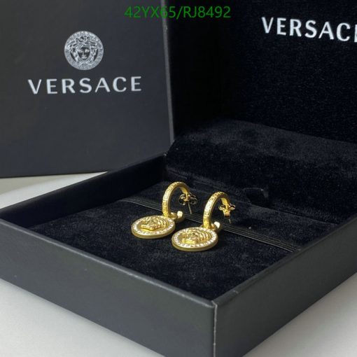 Versace gold hoop earrings in branded box.