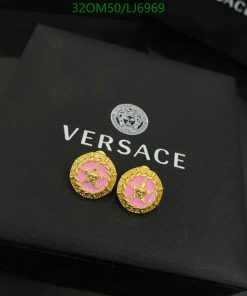 Versace gold pink stud earrings on branded box