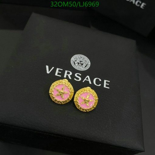 Versace gold pink stud earrings on branded box