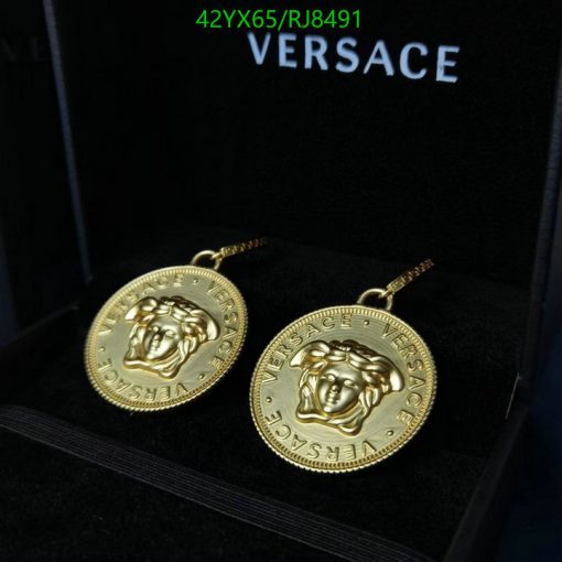 Gold Versace medusa head earrings in box