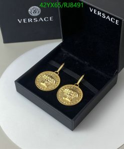 Versace gold medallion earrings in box.